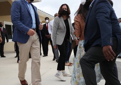 Kamala Harris shows off her Converse shoes in Miami Gardens, Florida. Getty Images via AFP