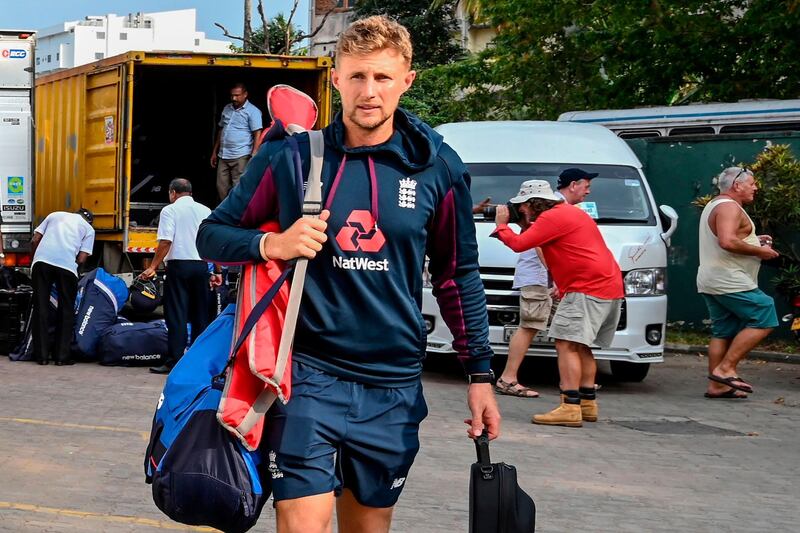 England captain Joe Root walks to the bus after the Test series against Sri Lanka was postponed. AFP