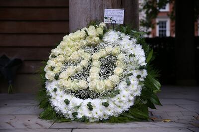 A floral tribute from BCG Partners laid at the September 11 Memorial Garden at Grosvenor Square in London. Hollie Adams / Getty Images