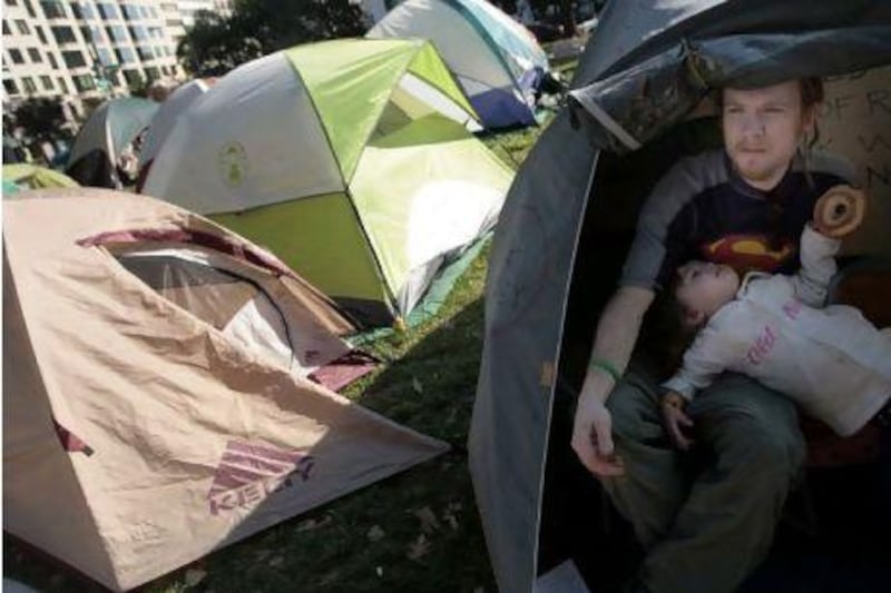 Soren Powell and his daughter, Willow, in the Occupy DC encampment in McPherson Square in Washington.