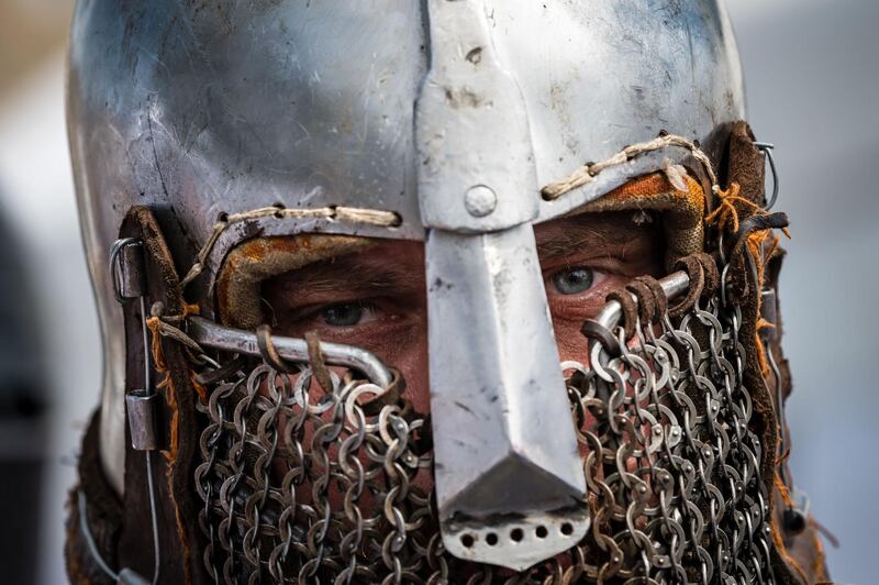 A French enthusiast wearing armour prepares for a fight during the medieval tournament "Battle of the Nations" at the Smederevo fortress, in eastern Serbia. Up to 25 countries take part in the annual historical medieval competition which was first held in Ukraine in 2009. AFP