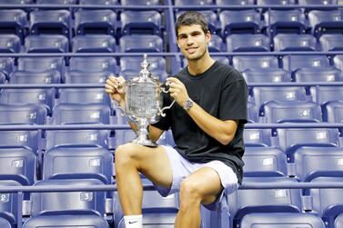 Carlos Alcaraz of Spain poses inside the Arthur Ashe Stadium with the championship trophy after defeating Casper Ruud of Norway during the men's final match at the US Open Tennis Championships at the USTA National Tennis Center in Flushing Meadows, New York, USA, 11 September 2022.   EPA / JASON SZENES