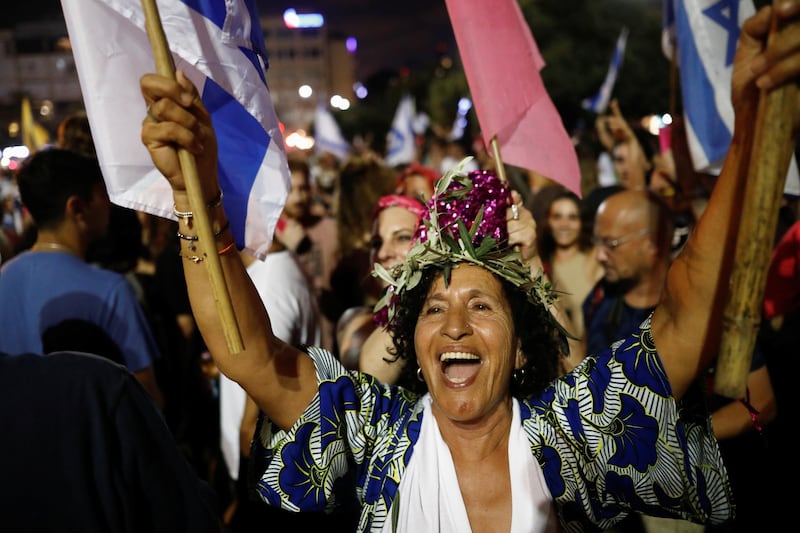 People celebrate after Israel's parliament voted in a new coalition government, ending Benjamin Netanyahu's 12-year hold on power, at Rabin Square in Tel Aviv, Israel. Reuters