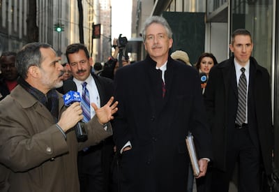 (FILES) In this file photograph taken on January 16, 2010, a reporter from Iranian television (L) asks a question of US diplomat Williams Burns (C) as he leaves a meeting of the 'Iran 6' in New York. As six major powers huddled behind closed doors to mull a response to Iran's nuclear defiance.   US President-elect Joe Biden on January 11, 2021, has announced William Burns as his pick to lead the Central Intelligence Agency, tapping a veteran diplomat who has served in posts around the world. / AFP / Don EMMERT
