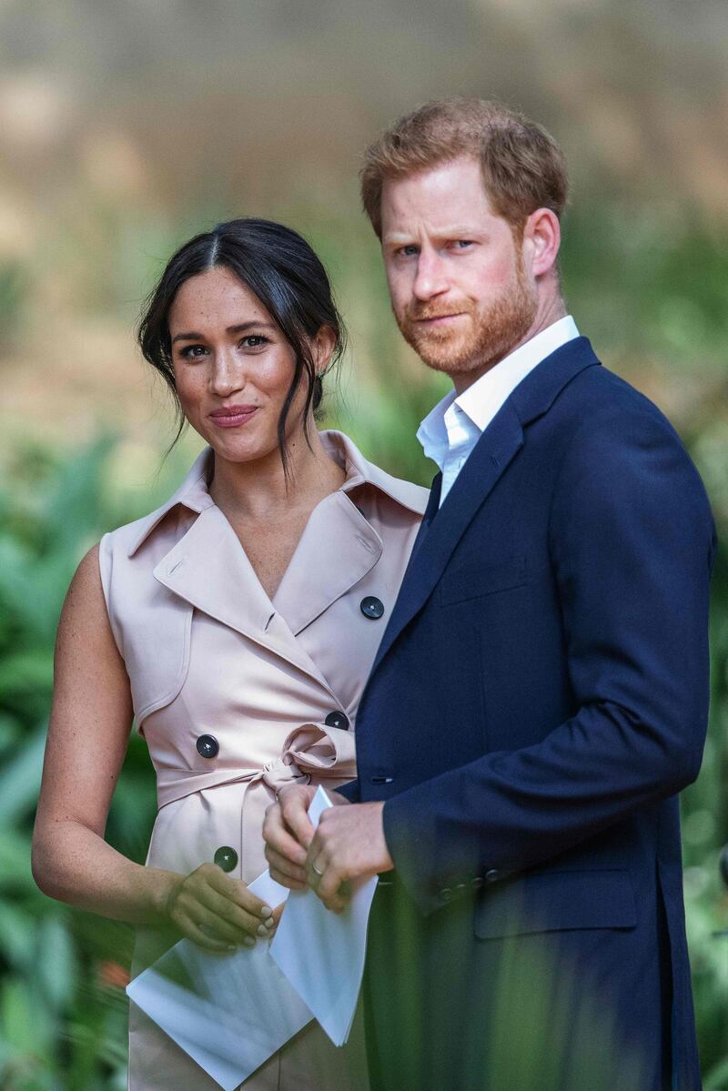 (FILES) In this file photo taken on October 02, 2019 Britain's Prince Harry, Duke of Sussex(R) and Meghan, the Duchess of Sussex(L) arrive at the British High Commissioner residency in Johannesburg where they  will meet with Graca Machel, widow of former South African president Nelson Mandela, in Johannesburg.  Prince Harry has filed a new claim for breach of privacy against British tabloid newspapers, media and the publishing group concerned said on October 4, 2019. - France OUT until 2019-10-17T00:00:00.000+02:00
 / AFP / Michele Spatari
