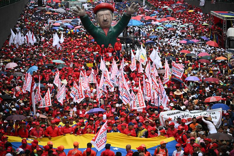Supporters of Venezuelan President Nicolas Maduro's government participate in a march during a May Day rally to mark the international day of the workers in Caracas. AFP