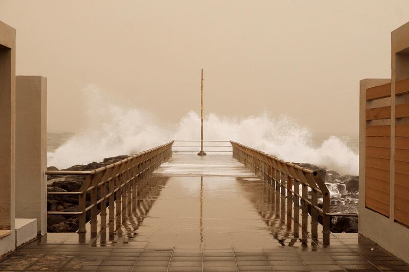 Big waves hit the sea promenade of El Burrero's beach during a windy afternoon in Las Palmas de Gran Canaria, Canary Islands on February 23, 2020.  EPA