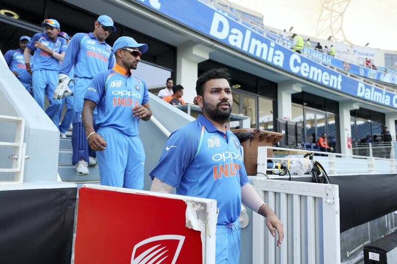 Dubai, United Arab Emirates - September 23, 2018: India's Rohit Sharma leads his team out during the game between India and Pakistan in the Asia cup. Sunday, September 23rd, 2018 at Sports City, Dubai. Chris Whiteoak / The National