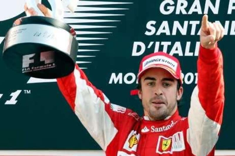 Fernando Alonso celebrates his win at Monza.