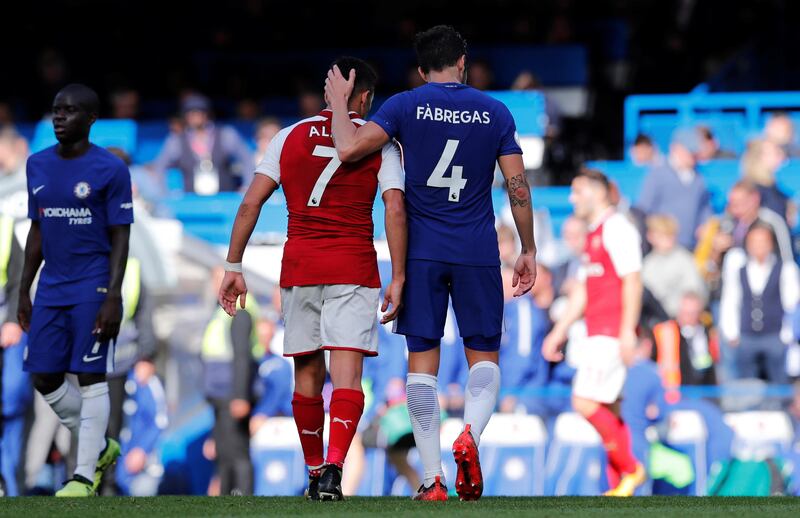 Cesc Fabregas, right, and Alexis Sanches after the game between Chelsea and Arsenal. Eddie Keogh / Reuters