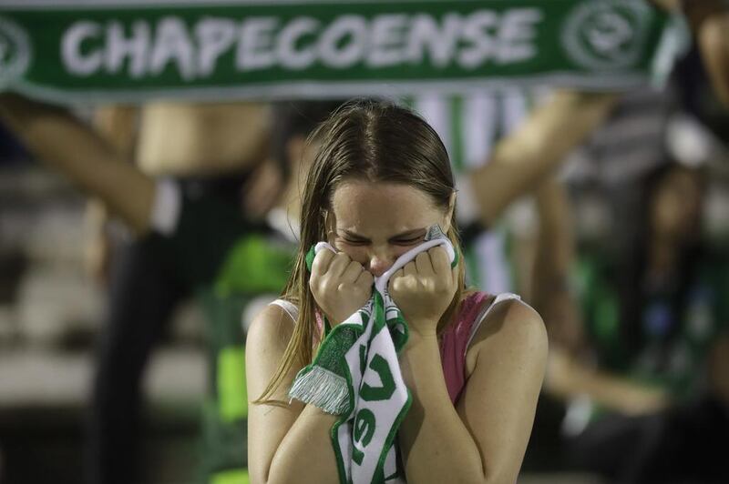 A fan of the Brazilian football team Chapecoense weeps  during a gathering inside Arena Conda stadium in Chapeco, Brazil, on Tuesday, November 29, 2016 to mourn the footballers killed in an air crash near Medellin, Colombia. . Andre Penner / AP 