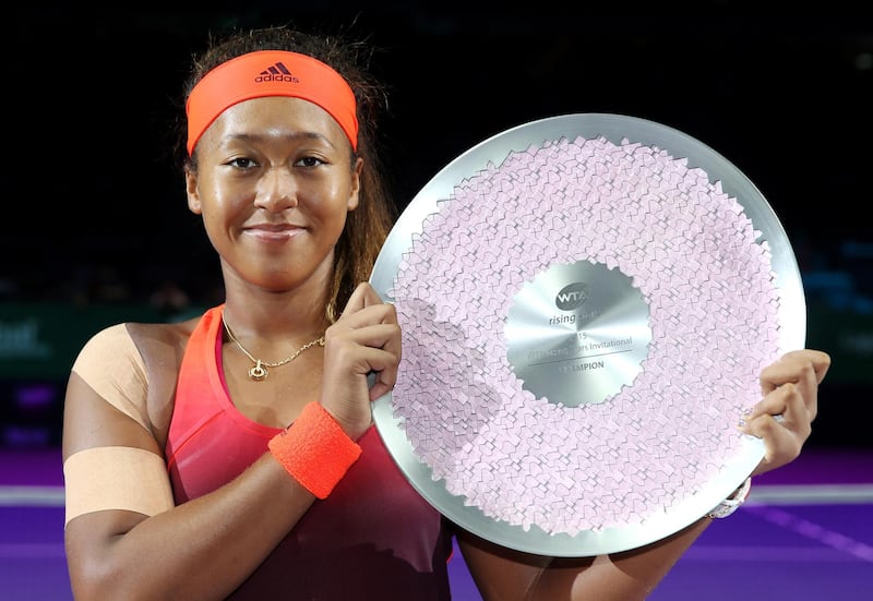 SINGAPORE - OCTOBER 25:  Naomi Osaka of Japan holds the winners trophy after defeating Caroline Garcia of France during the WTA Rising Stars Final at Singapore Sports Hub on October 25, 2015 in Singapore.  (Photo by Matthew Stockman/Getty Images for WTA)