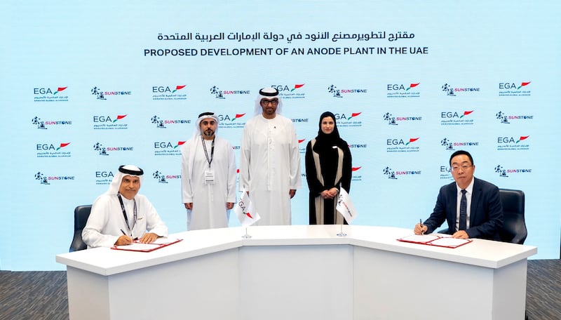EGA chief executive Abdulnasser bin Kalban, left, signs agreements in the presence of Dr Sultan Al Jaber, UAE Minister of Industry and Advanced Technology and President-designate of Cop28. Photo: EGA