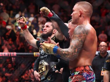 NEWARK, NEW JERSEY - JUNE 01: (L-R) Islam Makhachev of Russia celebrates defeating Dustin Poirier in their lightweight title bout during UFC 302 at Prudential Center on June 01, 2024 in Newark, New Jersey.    Luke Hales / Getty Images / AFP (Photo by Luke Hales  /  GETTY IMAGES NORTH AMERICA  /  Getty Images via AFP)