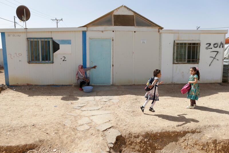 Children play at the Refugee Camp of Zaatari, near the Syrian Border, 100km North West of Amman, Jordan.  EPA