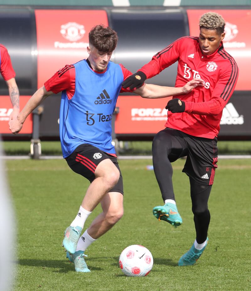 Charlie Wellens and Marcus Rashford battle for the ball. 