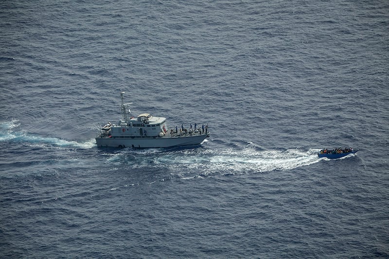 A Libyan coastguard ship intercepts a migrant vessel as it makes the dangerous crossing to Europe. AP