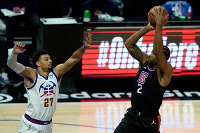 LA Clippers forward Kawhi Leonard (2) takes a shot against Denver Nuggets guard Jamal Murray (27) during the first quarter of an NBA basketball game Thursday, April 1, 2021, in Los Angeles. (AP Photo/Ashley Landis)