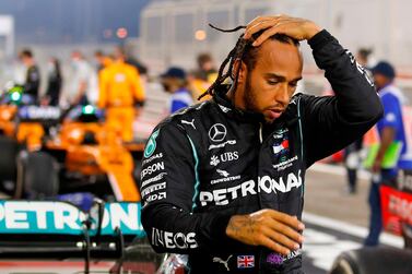 Mercedes' British driver Lewis Hamilton steps out of his car after winning the Bahrain Grand Prix on November 29. He will miss this weekend's Sakhir Grand Prix after being infected with the coronavirus. AFP