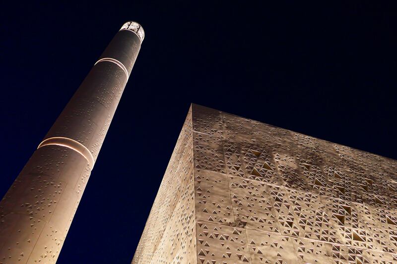 The mosque and its minaret against the evening sky.