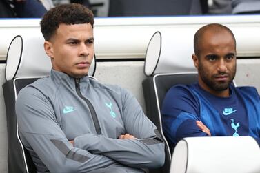 Tottenham Hotspur midfielder Dele Alli, left, on the bench during their Premier League defeat to Brighton on Saturday, October 5. EPA