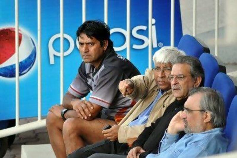 The UAE coach Aaqib Javed, far left, sits with officials of Emirates Cricket Board.