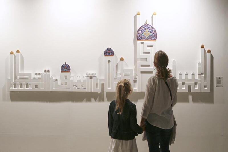 Work by Nasser Al Salem and Dana Awartani, The Hour will not come to pass until people are seen competing in lofty mosques. Sarah Dea / The National
