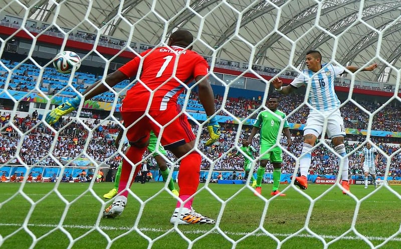 Marcos Rojo of Argentina scores his team's third goal past Vincent Enyeama of Nigeria during their match on Wednesday at the 2014 World Cup. Jeff Gross / Getty Images