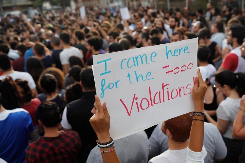 Supporters of Joumana Haddad protest against what they say are clear signs of election fraud outside the Interior Ministry in Beirut. Hussein Malla / AP Photo