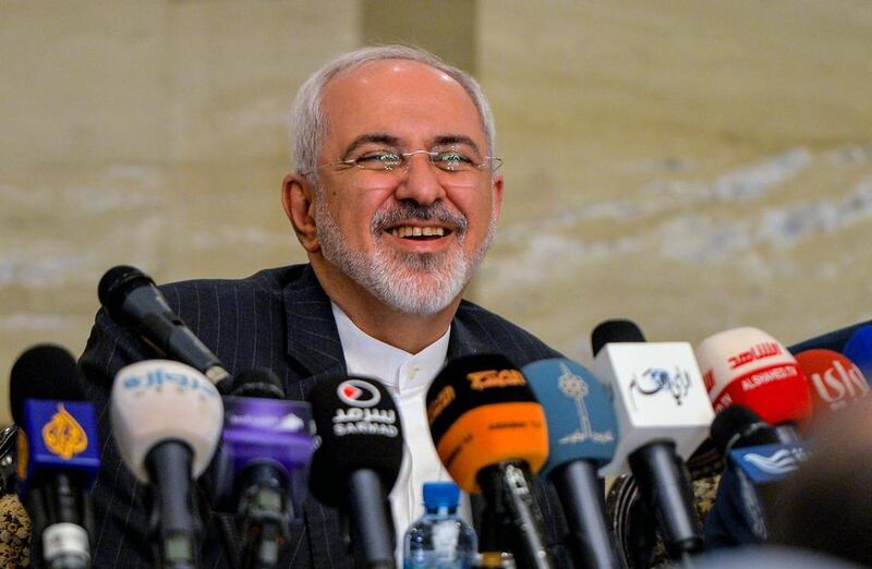 Iranian Foreign Minister Mohammad Javad Zarif smiles during a press conference.