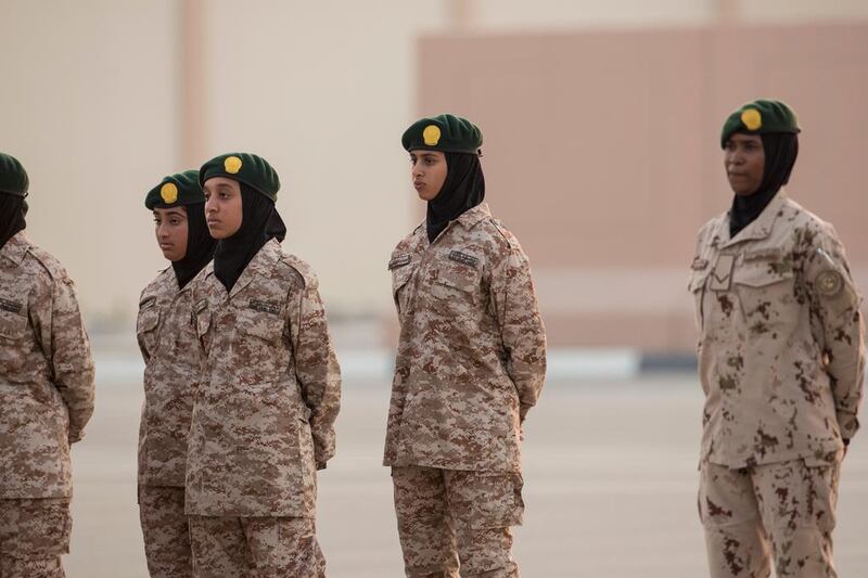 Sheikha Hassa bint Mohammed bin Zayed, second right, takes part in a Khawla bint Alazwar military school graduation ceremony.