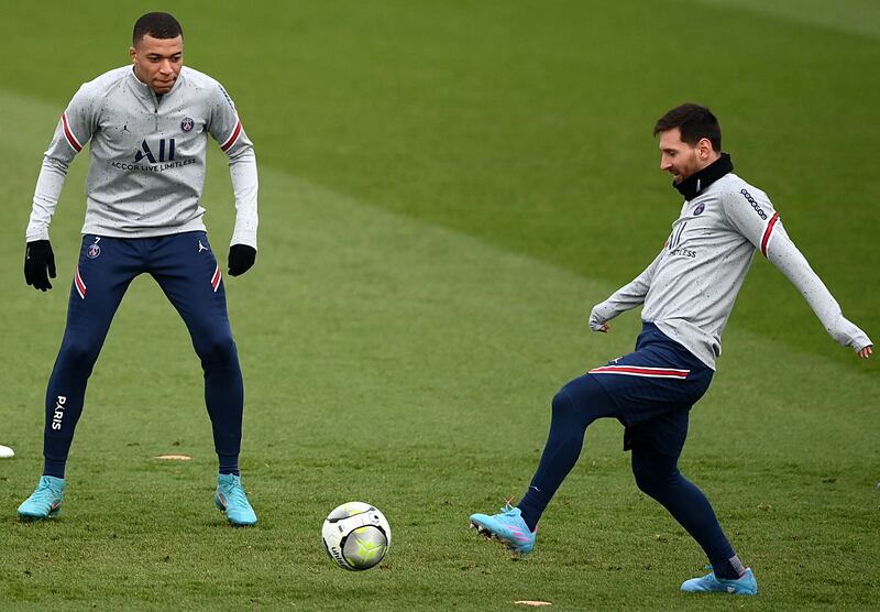 PSG attackers Lionel Messi and Kylian Mbappe during training. AFP