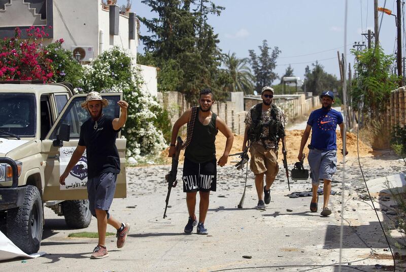 Fighters loyal to the internationally recognised Libyan Government of National Accord (GNA) gather during clashes with forces loyal to strongman Khalifa Haftar in the capital Tripoli's suburb of Ain Zara.  AFP