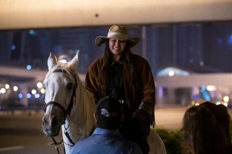 The riders on horseback were a stark contrast to the SUVs and supercars the people of Dubai are used to seeing speed on the seven-lane road. Photo: Ruel Pableo for The National