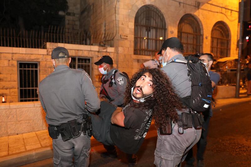 Israeli police detain demonstrators during a protest against Israeli Prime Minister Benjamin Netanyahu outside his residence in Jerusalem, Israel.  EPA