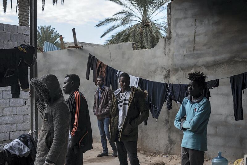 Refugees mostly from Darfur, Sudan are gathered in the courtyard of the place where they live in Gorgi district, south of Tripoli. Migrants and refugees are often living in dire conditions, in dilapidated buildings or small unfinished houses deprived of basic services.