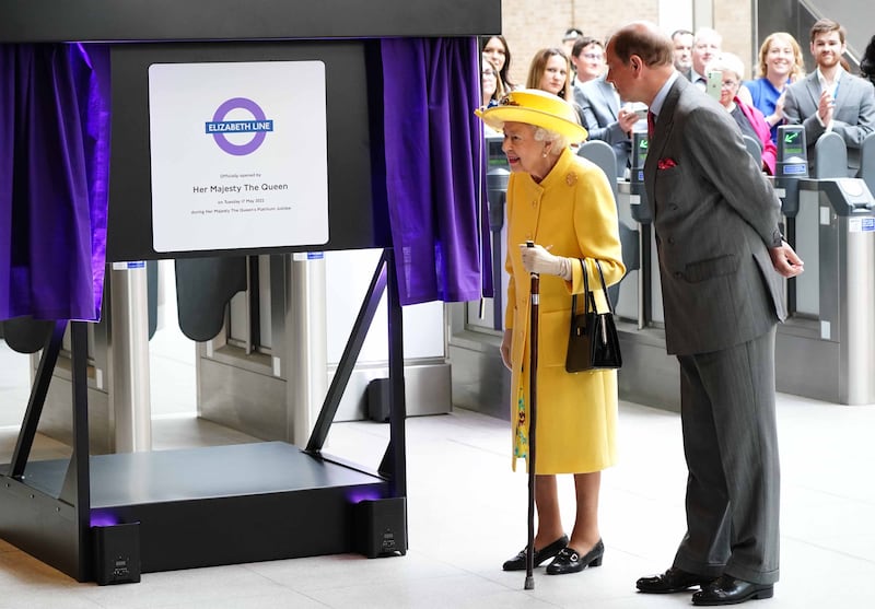The queen and Prince Edward unveil a plaque at Paddington station. PA