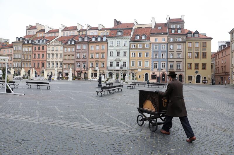 Mandatory Credit: Photo by Tomasz Gzell/EPA-EFE/Shutterstock (10978101b)
A barrel organ player on the empty Old Town Square in Warsaw, Poland, 28 October 2020, amid the ongoing pandemic of the COVID-19 disease caused by the SARS-CoV-2 coronavirus. The number of confirmed coronavirus cases in Poland has increased since 27 October by 18,820 new infections, a new daily record, and reached 299,049, the Ministry of Health said on 28 October. Another 236 persons have died, bringing the death toll to 4,851.
Empty Old Town Square in Warsaw, Poland - 28 Oct 2020