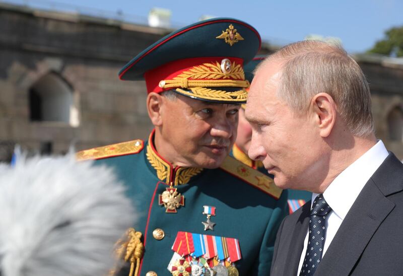 Russian President Vladimir Putin (R) and Russian Defense Minister Sergei Shoigu (L) attend the Main Naval Parade marking the Russian Navy Day in St. Petersburg, Russia.  EPA / MICHAEL KLIMENTYEV