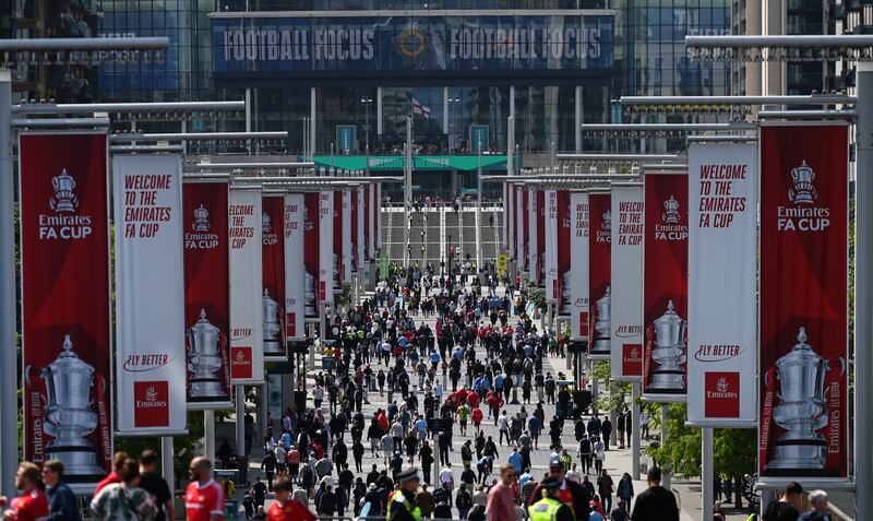 Manchester City and Manchester United fans walk up Olympic Way to Wembley Stadium ahead of the first ever Manchester derby FA Cup final at Wembley Stadium in London, Britain, 03 June 2023.   EPA / ANDY RAIN