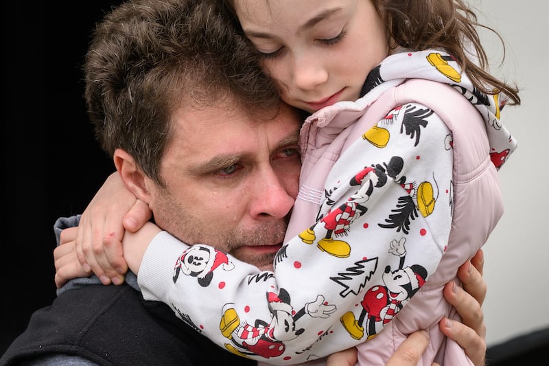 Eugene Yevchenko cries as he bids farewell to his daughter Maria at a coach station in Lviv. Getty Images