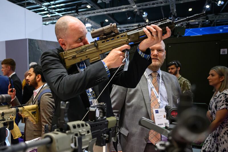 A visitor with a Heckler & Koch SA80 A3 calibre 5.56 x 45mm Nato at the Defence and Security Equipment International fair at ExCel, London. Getty Images