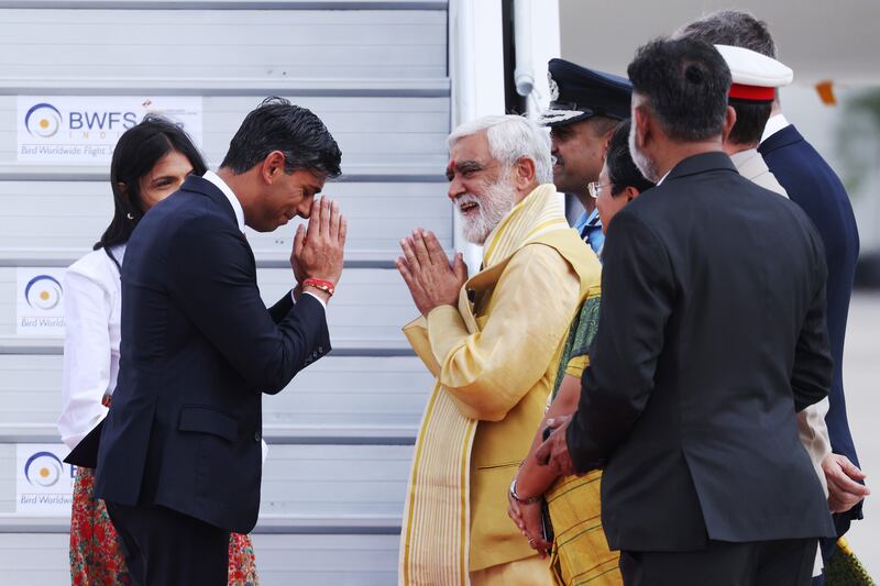 UK Prime Minister Rishi Sunak and his wife Akshata Murty are greeted by India's Minister of State for Consumer Affairs Ashwini Kumar Choubey and other dignitaries at Indira Gandhi International Airport. PA