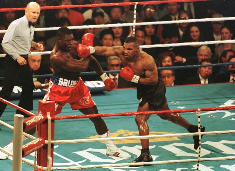 16 Mar 1996:  Mike Tyson lands a right to Frank Bruno in the first round of the WBC Heavyweight Championship bout at the MGM Grand in Las Vegas, Nevada.  Tyson won the title after referee Mills Lane stopped the fight in the third round. Mandatory Credit: Getty Images