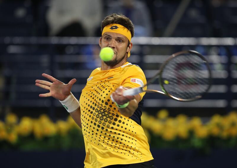 Jiri Vesely hits a forehand to Andrey Rublev during the Dubai final. EPA