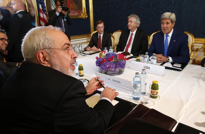 Iran's Foreign Minister Javad Zarif, left, holds a bilateral meeting with US Secretary of State John Kerry, right, on the second day of talks over Tehran's nuclear program in Vienna on July 14, 2014. Jim Bourg/Reuters