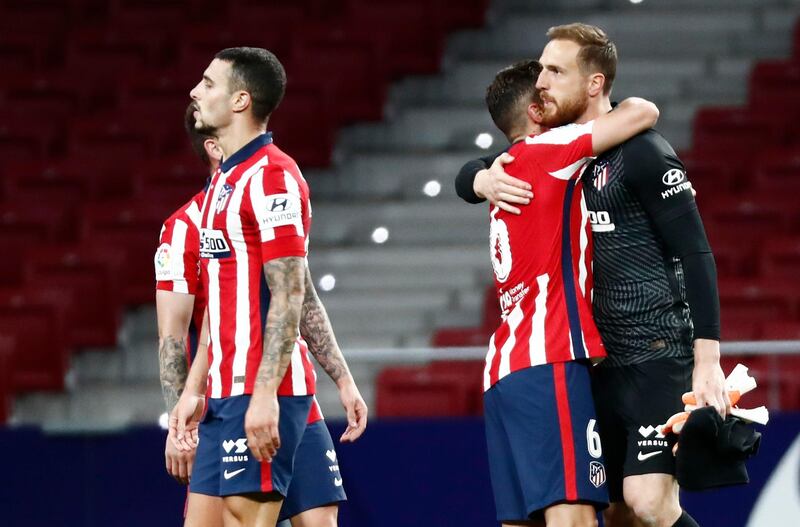 Atletico Madrid's Koke with Jan Oblak celebrate after the match. Reuters