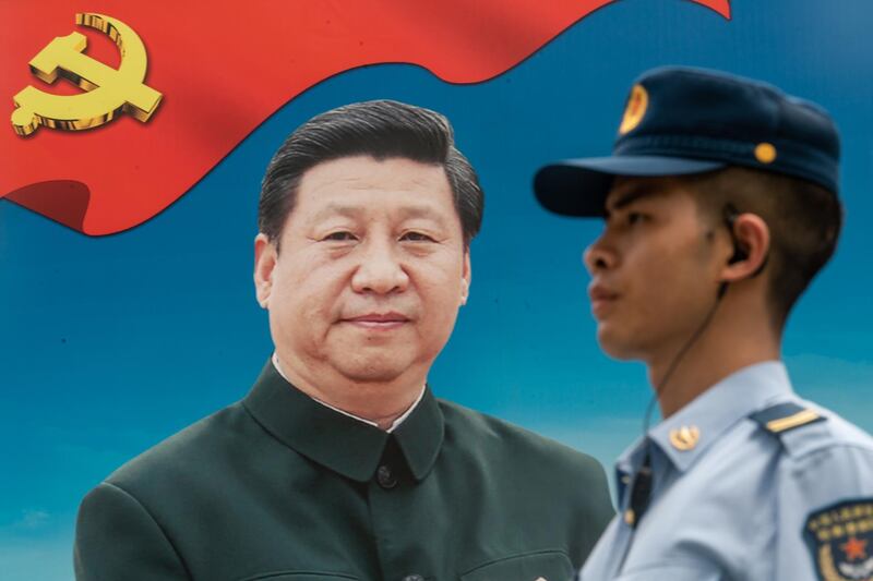 HONG KONG, HONG KONG - June 30: A member of the People's Liberation Army (PLA) stands guard in front of a billboard of Chinese President Xi Jinping at the Shek Kong Barracks on June 30, 2018 in Hong Kong, Hong Kong. Hong Kong will mark 21 years since its return to Chinese sovereignty from British rule on Sunday as thousands of people are expected to turn up for an annual rally to demand full democracy and vent their frustration over the soaring accommodation costs in the world's most expensive city for expatriates. (Photo by Anthony Kwan/Getty Images)