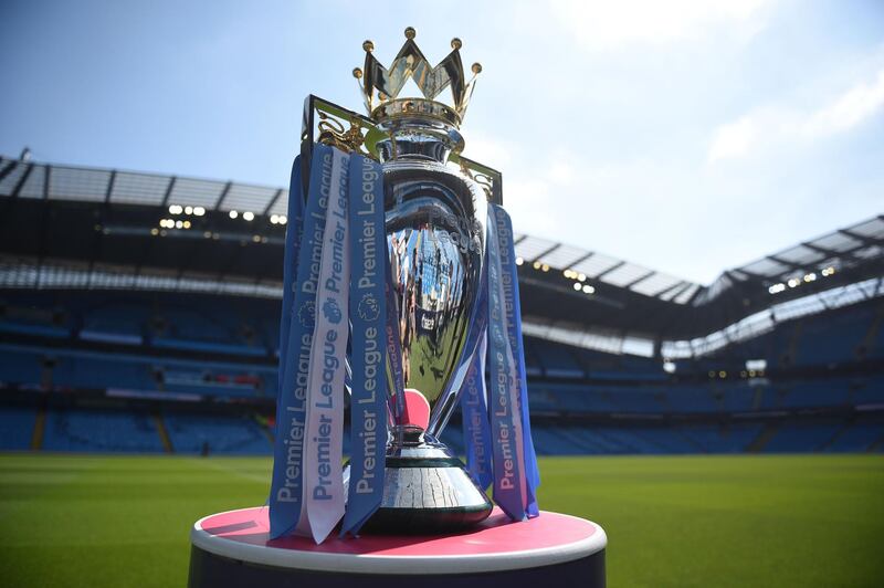 (FILES) In this file photo taken on May 06, 2018 The English Premier League football trophy is pictured before the English Premier League football match between Manchester City and Huddersfield Town at the Etihad Stadium in Manchester. Professional Footballers' Association chief Gordon Taylor says Premier League players have "agreed to play their part" during the coronavirus pandemic as talks continue to find a collective pay deal on April 7, 2020. - RESTRICTED TO EDITORIAL USE. No use with unauthorized audio, video, data, fixture lists, club/league logos or 'live' services. Online in-match use limited to 75 images, no video emulation. No use in betting, games or single club/league/player publications. 
 / AFP / Oli SCARFF                           / RESTRICTED TO EDITORIAL USE. No use with unauthorized audio, video, data, fixture lists, club/league logos or 'live' services. Online in-match use limited to 75 images, no video emulation. No use in betting, games or single club/league/player publications. 
