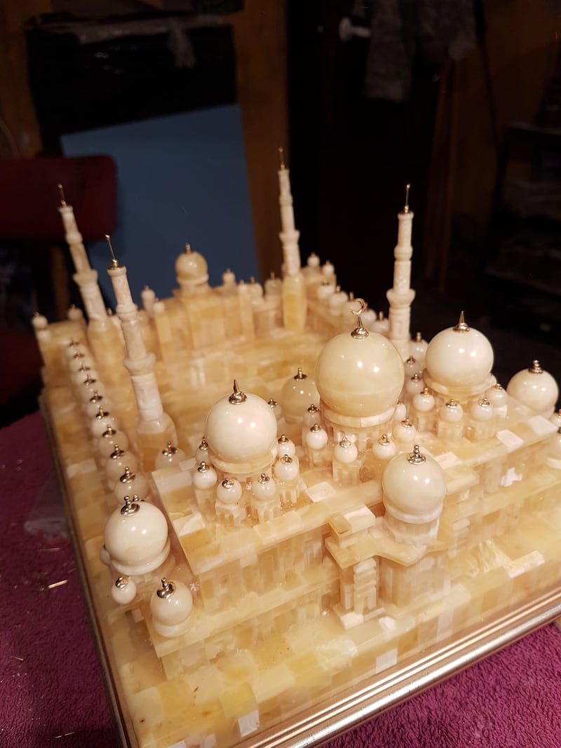 The craftsman specialises in building sculptures of mosques, lighthouses, churches and ships covered with glistening honey-coloured amber stones.